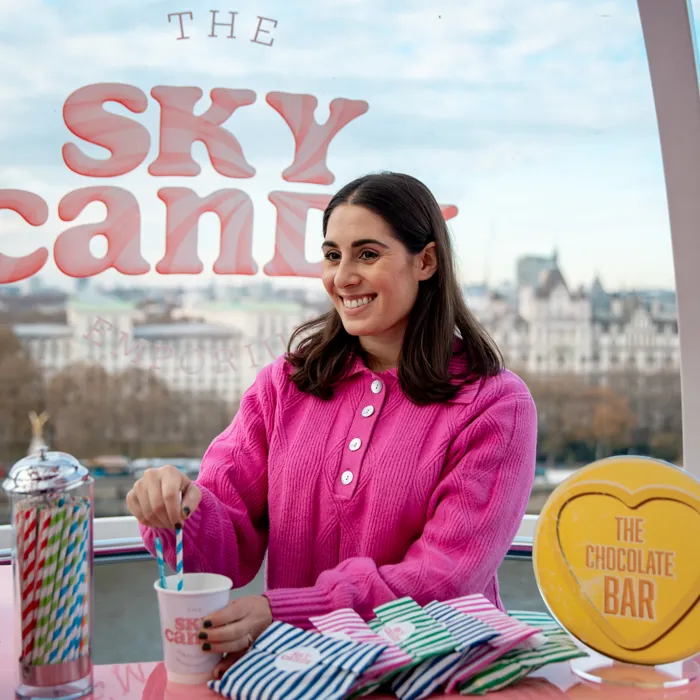Woman stirring drink on the London Eye