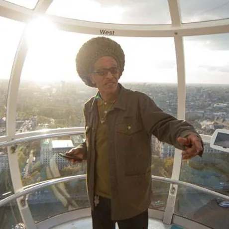 Man on london eye at sunset